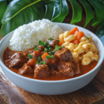 Hawaiian beef stew served with white rice and macaroni salad on a plate